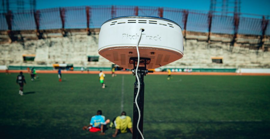The PitchTrack hub — a sealed white head housing the cameras and the recorder