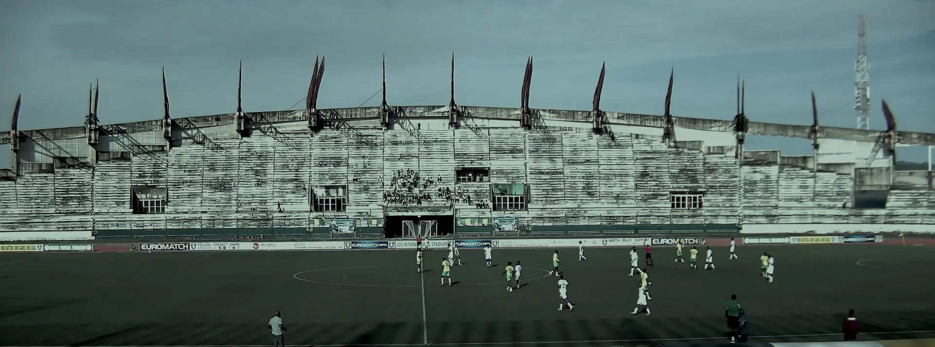 A league match in play at Jos International Stadium, seen from the opposite stand